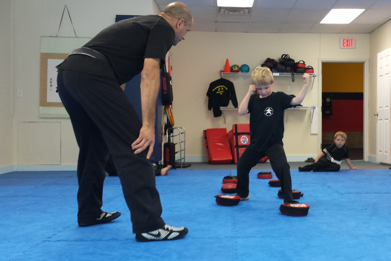 Child practicing martial arts techniques at Martial Way Self-Defense Center