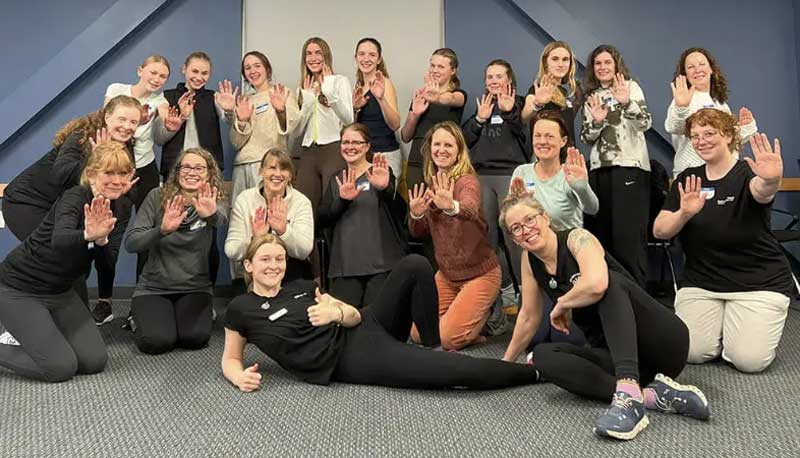 Martial Way News - August 2026 2 Participants celebrate completing a Safety Team Empowerment Self-Defense class by posing together with raised hands.